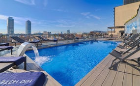 Outdoor pool with views of the city skyline